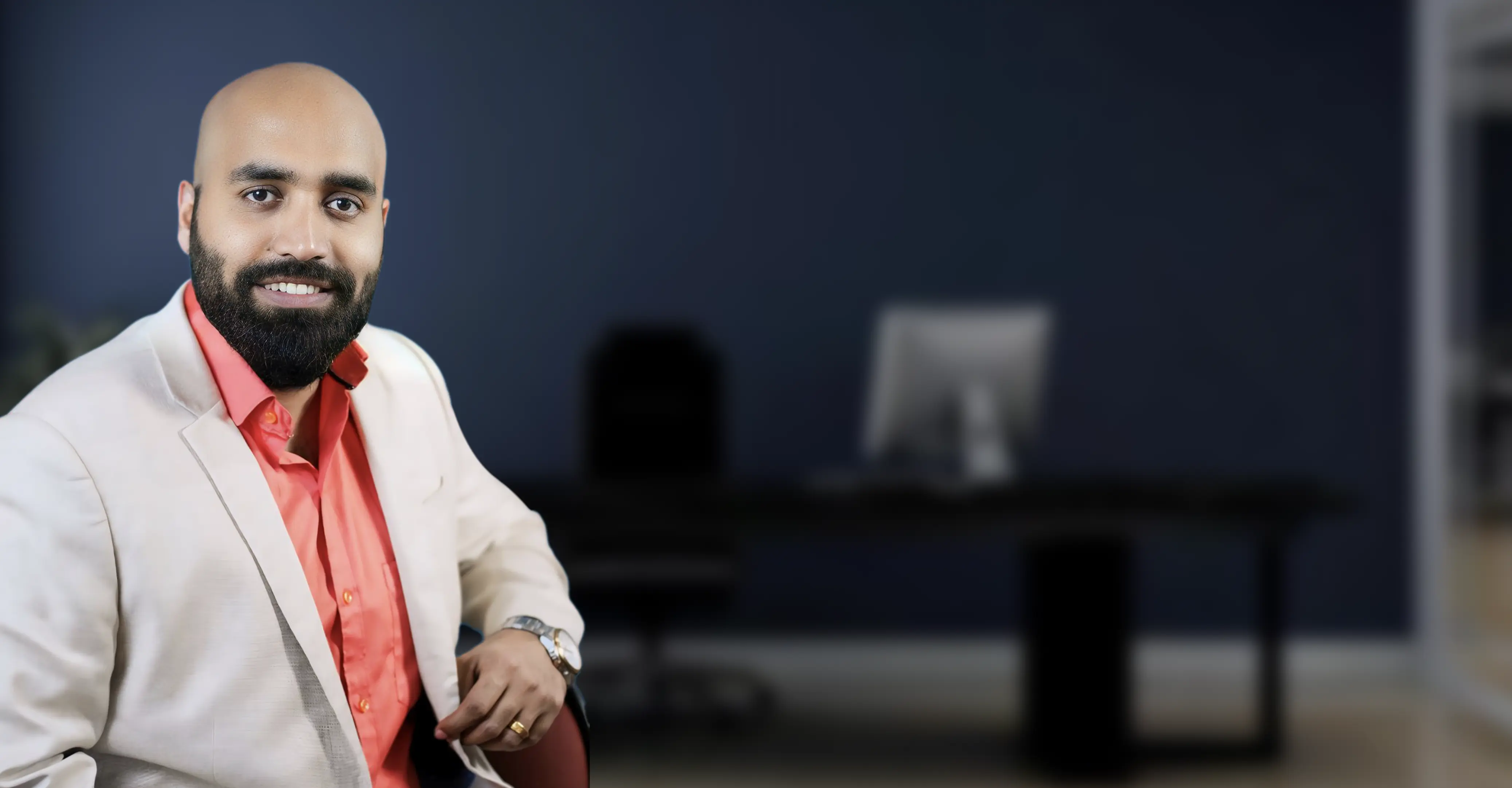 Portrait of Dr Jithin Jacob, principal audiologist, providing expert hearing test services in a modern clinic office.